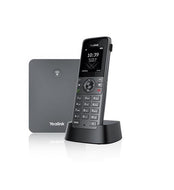 Yealink W73P DECT IP phone system featuring W73H wireless handset on charging cradle alongside compact W70B base station
